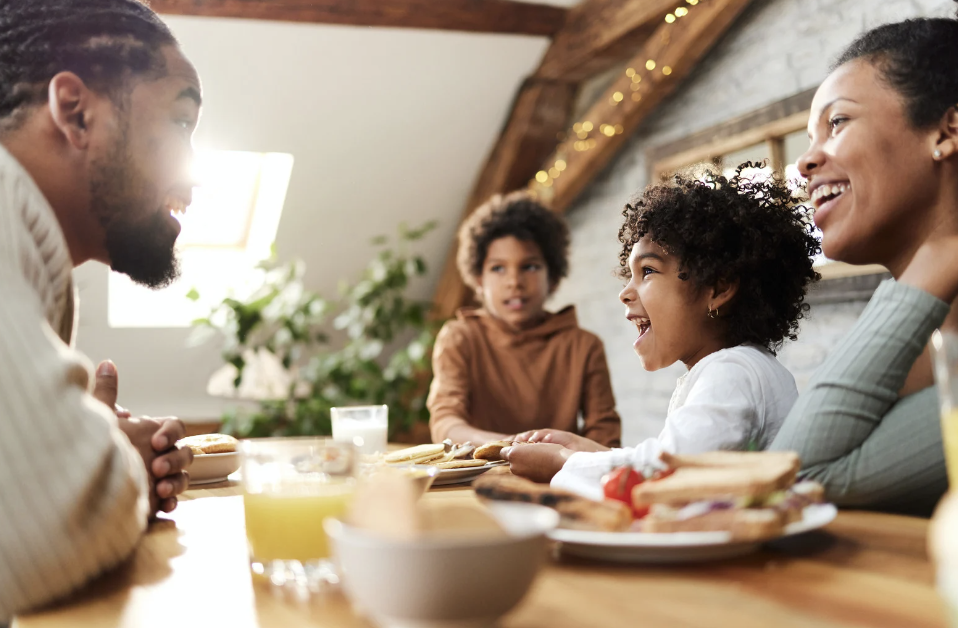 family at table eating together